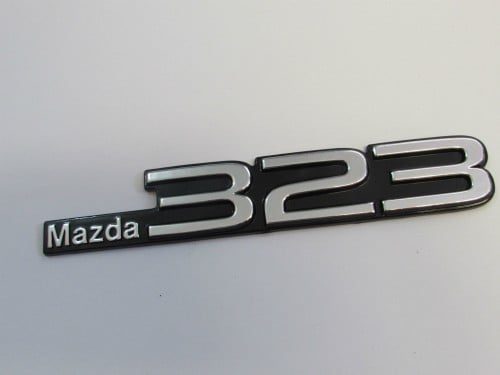 Emblem Tempel Mazda323 Ukuran 17x3cm