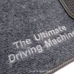 Karpet BMW Seri 5 E39 Bahan Beludru Premium Warna Abi-Abu Logo Tulisan The Ultimate Driving Machine - 2 Baris