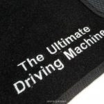 Karpet BMW Seri 7 E38 Bahan Beludru Super Warna Hitam Logo Tulisan The Ultimate Driving Machine - 2 Baris